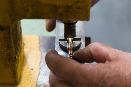 Production of articles in brass made with microcasting technique