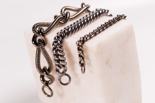 creation of chains for coats for high fashion